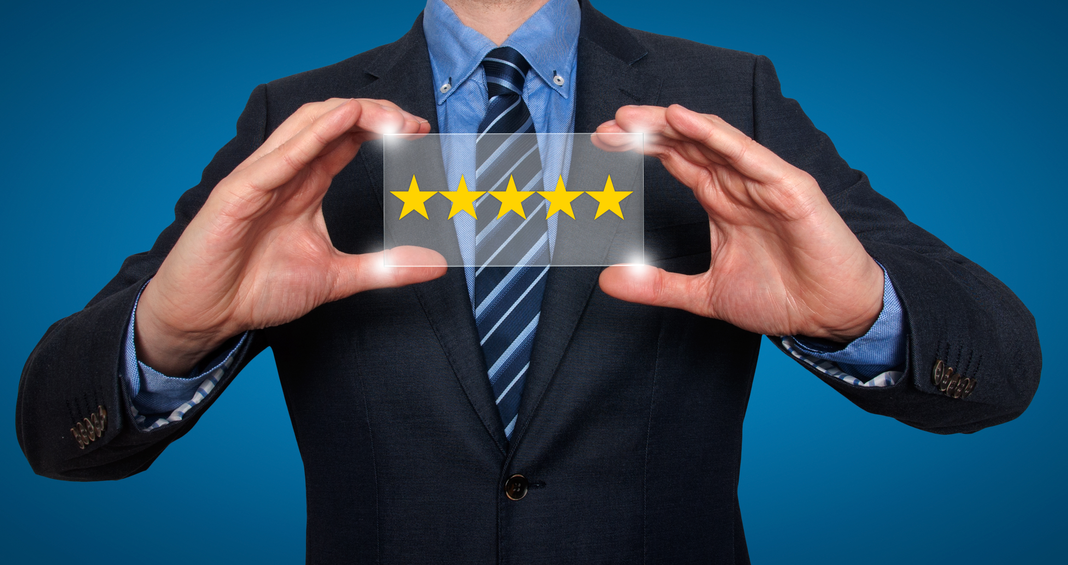 Businessman holding five star rating - Stock Image. For different background please check my portfolio.